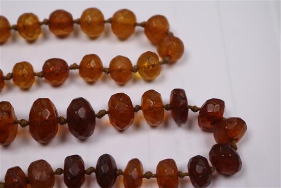 Five assorted amber necklaces.